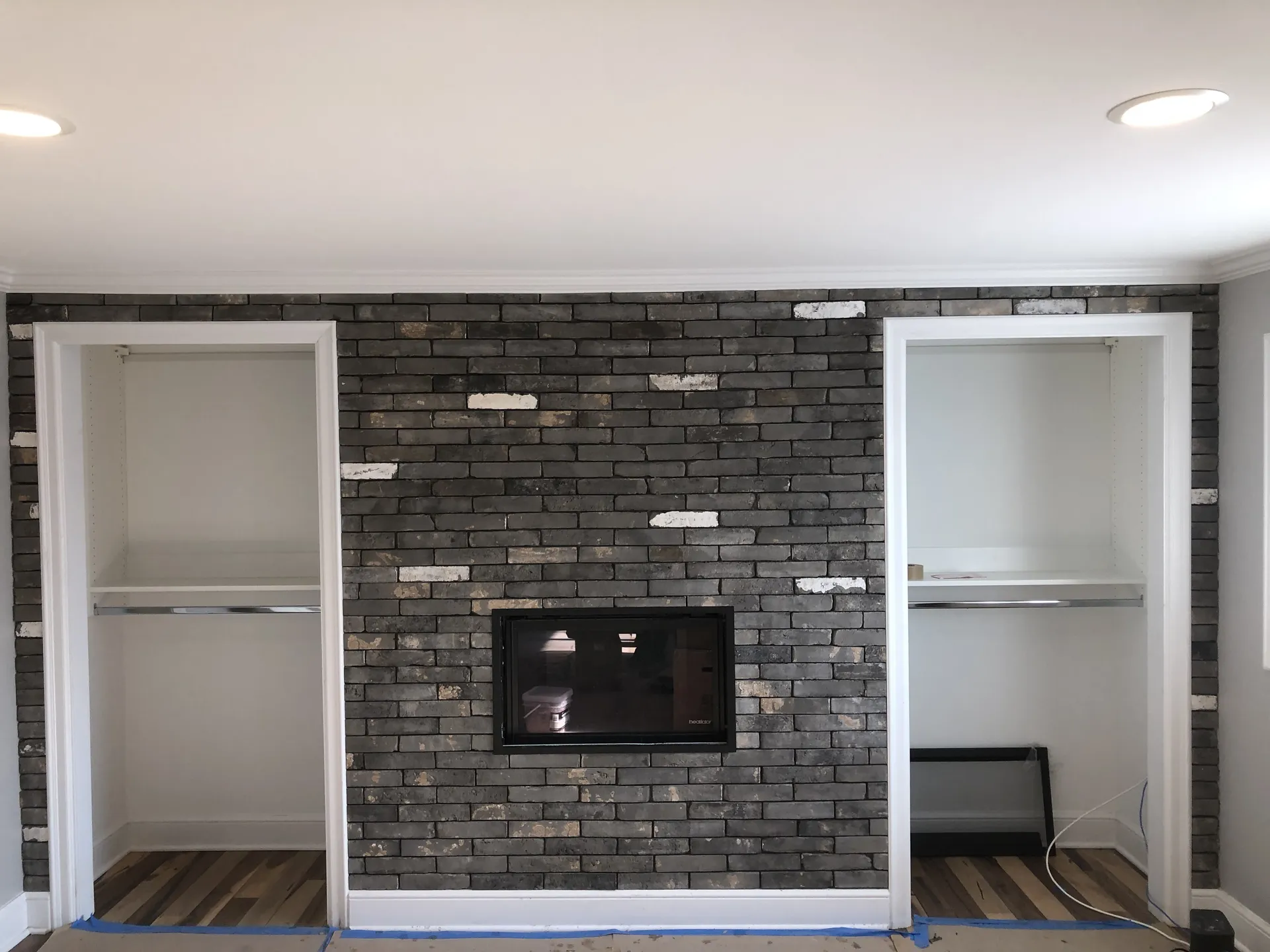 Residential living room with custom thin-brick tile feature wall and fireplace