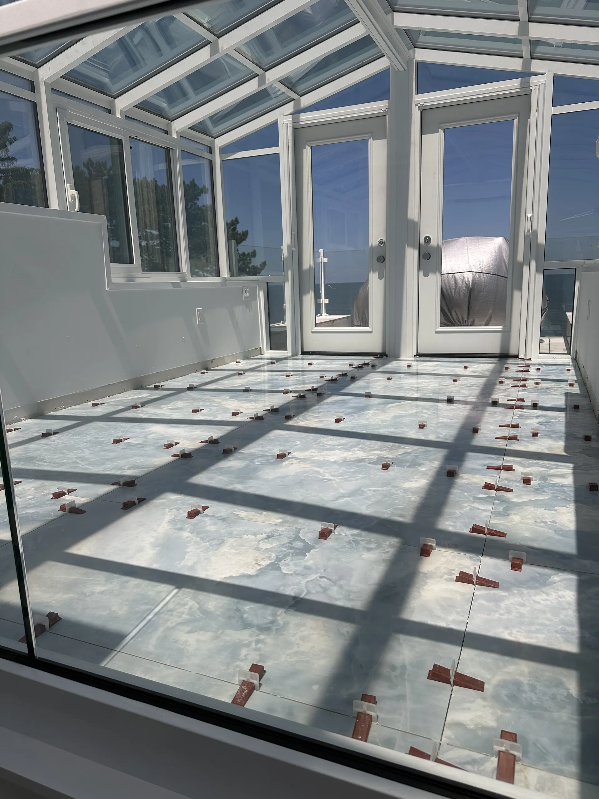 Professional floor tile installation with large-format porcelain tiles